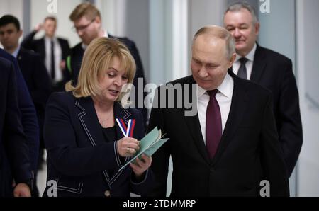 Moscow, Russia. 18 December, 2023. Russian President Vladimir Putin, right, walks with Central Election Commission Chairperson Ella Pamfilova, left, as he registers as a candidate in the upcoming 2024 Russian presidential election at the Central Election Commission, December 18, 2023 in Moscow, Russia. Credit: Russian Presidency/Kremlin Pool/Alamy Live News Stock Photo