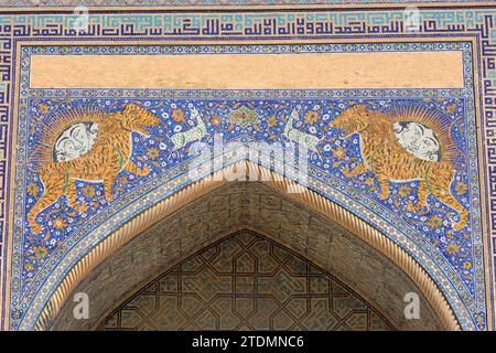 Detail of tiger mosaic on the Sher Dor Madrasa at the Registan in Samarkand Uzbekistan in August 2022 Stock Photo