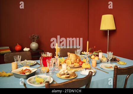 Medium full shot of cozy living room prepared for thanksgiving feast Stock Photo