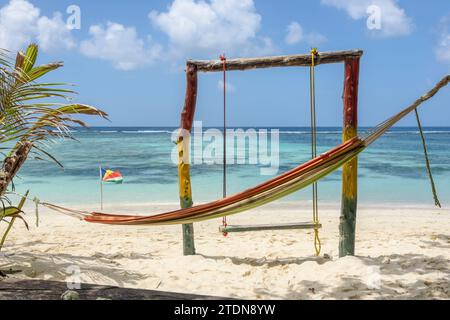 Hammock and swing at a beach cafe shack on Anse Source d'Argent, La Digue Island, Seychelles. Indian Ocean Stock Photo