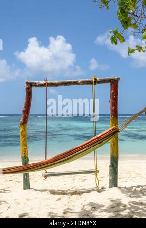 Hammock and swing at a beach cafe shack on Anse Source d'Argent, La Digue Island, Seychelles. Indian Ocean Stock Photo