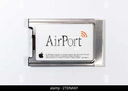 vintage PCMIA wifi airport apple computer card adapter isolated on white studio background Stock Photo