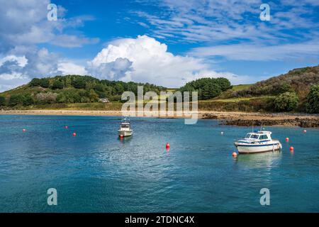 Boats moored off Fisherman’s Beach on Herm, Bailiwick of Guernsey, Channel Islands Stock Photo