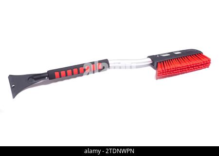 Car brush with a scraper for cleaning the car in winter about snow and ice, isolated on white Stock Photo