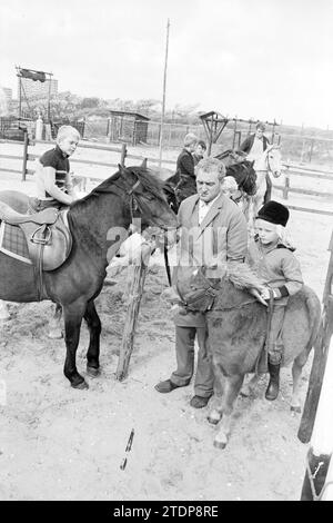 Riding school with girl on pony and boy on horse, 00-09-1968, Whizgle News from the Past, Tailored for the Future. Explore historical narratives, Dutch The Netherlands agency image with a modern perspective, bridging the gap between yesterday's events and tomorrow's insights. A timeless journey shaping the stories that shape our future Stock Photo