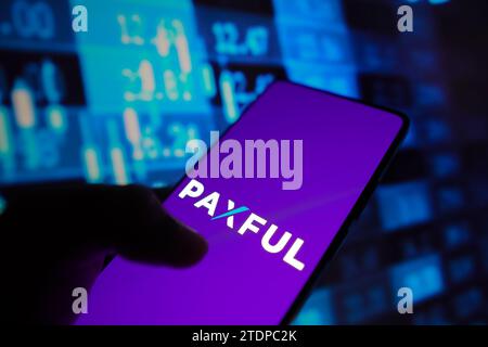 Brazil. 18th Dec, 2023. In this photo illustration, the Paxful logo is displayed on a smartphone screen with stock market percentages in the background. (Credit Image: © Rafael Henrique/SOPA Images via ZUMA Press Wire) EDITORIAL USAGE ONLY! Not for Commercial USAGE! Stock Photo
