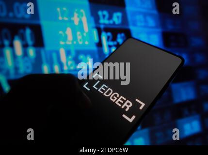 Brazil. 18th Dec, 2023. In this photo illustration, the Ledger logo is displayed on a smartphone screen with stock market percentages in the background. (Credit Image: © Rafael Henrique/SOPA Images via ZUMA Press Wire) EDITORIAL USAGE ONLY! Not for Commercial USAGE! Stock Photo