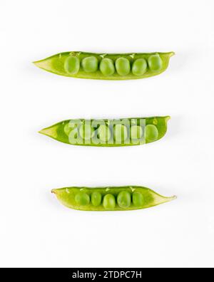 Pods with fresh green peas on white background Stock Photo