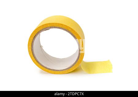 Roll of yellow masking tape on white background. Stock Photo