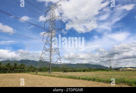 Alaminos, Philippines. December 19, 2023 : Power pylons and high voltage lines of the Bay–Biñan Transmission Line passing through Malepunyo mountains range. Yesterday, during Asia Zero Emission Community (AZEC) meeting in Tokyo, Pres. Marcos wooed Asean investments in renewable energy, promoting tax incentives and the lifting of foreign ownership limits. Philippines seeks to raise the sustainable energy share in its power generation to 50% in 2040. The Philippines is the 4th most attractive emerging markets globally for clean energies investments. Credit: Kevin Izorce/Alamy Live News Stock Photo