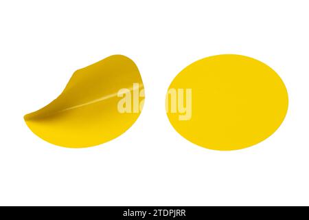 Round yellow stickers, blank tags labels isolated on a white background. Top view. Stock Photo