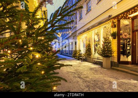 Nordic charm : christmas lights and festive decorations transform a Kragero town into a winter wonderland. High quality photo Stock Photo