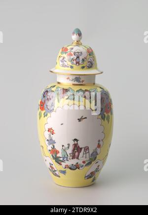 Vase, multicolored painted with Chinese in saved lobed circles in a yellow stock, Meissener Porzellan Manufaktur, c. 1735 Vase of painted porcelain. The vase is covered with a yellow stock, in which two garlands of Indianic blums are painted on the body and lid. In the yellow stock there are two large almost circular fields with lobed edges, in which contour chinoiseries are painted and six pear-shaped fields with birds and flowers. The vase is marked. Float porcelain Vase of painted porcelain. The vase is covered with a yellow stock, in which two garlands of Indianic blums are painted on the Stock Photo