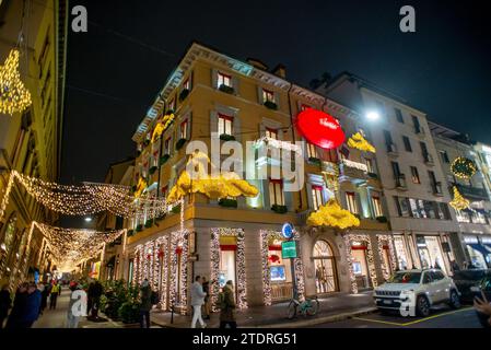 Milan Italy December 13 2023: Street in Milan where there are luxury shops, lit up for Christmas Stock Photo
