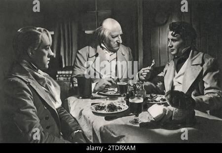 Alec Guinness, Finlay Currie, and John Mills come together in the timeless classic 'Great Expectations' (1946). Based on Charles Dickens' novel, the film delves into the life of Pip, played by Mills, as he navigates his journey from a humble blacksmith's apprentice to a gentleman in London, influenced by a mysterious benefactor. Stock Photo