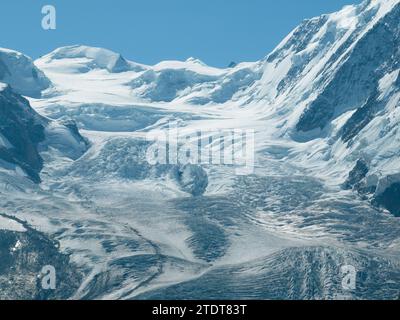 Serene summer landscape, the famous Matterhorn mountain in Zermatt, Switzerland, gently mirrors its grandeur in the calm waters of Riffelsee. Breathta Stock Photo