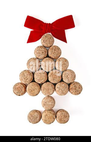 Champagne corks laid out in the shape of a Christmas tree tied up in red isolated on a white background Stock Photo