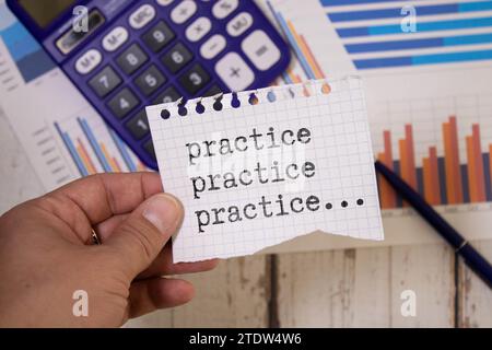 Concept of Practice, Practice, Practice write on sticky notes isolated on Wooden Table. Stock Photo