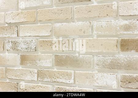 Light brown Ornamental brick wall forms part of interior in house inside,  background Stock Photo