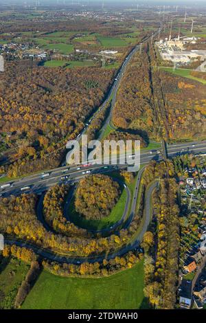 Aerial view of a highway interchange surrounded by green fields and ...
