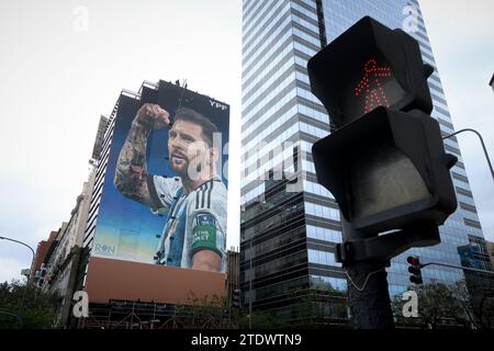 Buenos Aires, Argentina. 19th Dec, 2023. A mural of Lionel Messi is seen on the first anniversary of obtaining the Qatar 2022 World Cup champion trophy. A giant mural of Messi on Avenida 9 de Julio. The mural is a tribute to the world champion Lionel Messi on obtaining the world champion trophy in the 2022 World Cup in Qatar, made by the muralist Martín Ron, it is located in the center of the City of Buenos Aires. (Photo by Roberto Tuero/SOPA Images/Sipa USA) Credit: Sipa USA/Alamy Live News Stock Photo