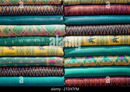 Colorful fabrics, bedspreads and kerchiefs with different oriental patterns green multi shades Stock Photo