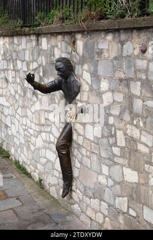 Dutilleul - The Passer Through Walls or Le Passe-Muraille Sculpture at Place Marcel Aymé in Montmartre, Paris, France Stock Photo