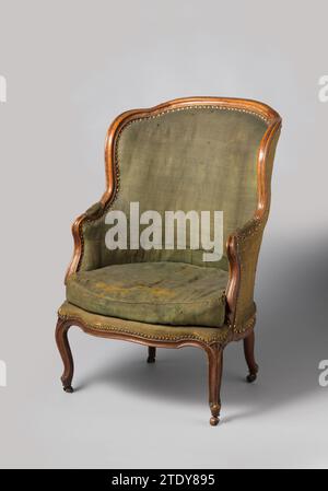 Chair of Willem Bilderdijk, Anonymous, 1750 Bergère van Notenhout, covered with green boring and with a loose pillow and leading role. The furniture rests on S-shaped legs, which turn into the sitting window without interruption. The semicircular sitting window is sculpted at the front. The armresters have pillows and end in volutes. The armrest stars are placed backwards, come from the sitting window and cross the armrests. These pass through the back window again without interruption. Upper sill is scalloped. Profile lists around. France wood (plant material). walnut (hardwood). serge   Neth Stock Photo