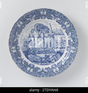 Dish of faience, painted in blue with the text: 