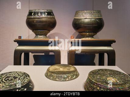 A display of various vases and plates made in the Mother of Pearl inlay design style. At the National Museum in Bangkok, Thailand. Stock Photo