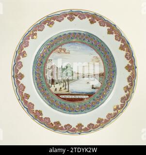 Plate with an image of the Golden Bend in the Herengracht, Amsterdam, anonymous, c. 1774 Porcelain plate, painted on the glaze in blue, red, pink, green, yellow, black and gold. On the Plat an image of the Golden Bend in the Herengracht in Amsterdam, based on an engraving by Roeland van Leuve (1691-1757); the wall with two intertwined spirals on a dotted soil; On the edge a band with leaf vines. A chip in the edge. Old label on the bottom with 'Exhibition of Oude Kunst/ Rijksmuseum 1929/ Alberge'. Decorated in Europe. Chinaminsterdam porcelain. glaze. gold (metal) painting / gilding / vitrific Stock Photo