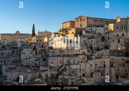 Matera, Italy - 26 November, 2023: view of the old city center of Matera with the stone houses in the last rays of sunlight Stock Photo