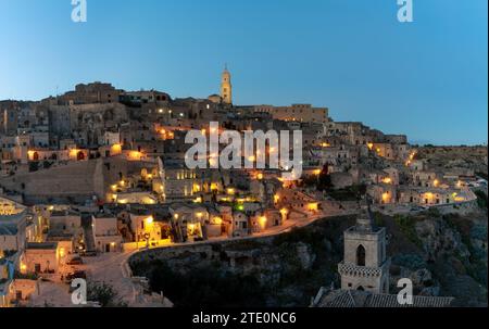 Matera, Italy - 26 November, 2023: view of the old town of Matera after sunset with the lights coming onMatera, Italy - 26 November, 2023: Stock Photo