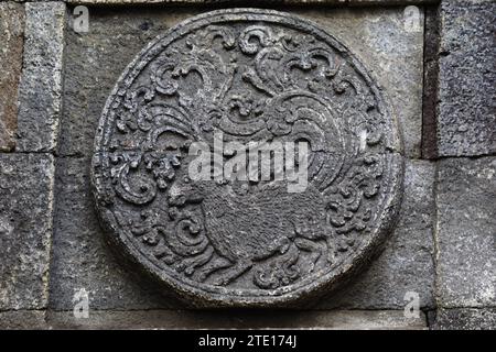 medallion in the penataran temple with animal reliefs. Stock Photo