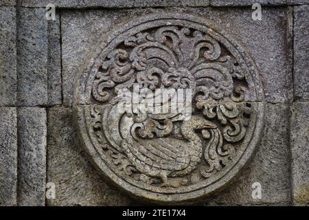 medallion in the penataran temple with animal reliefs. Stock Photo