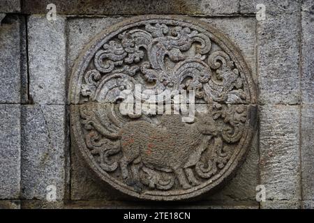 medallion in the penataran temple with animal reliefs. Stock Photo