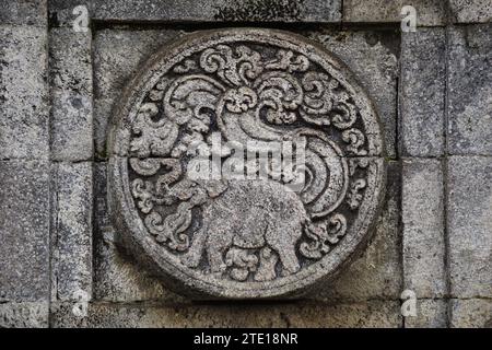 medallion in the penataran temple with animal reliefs. Stock Photo