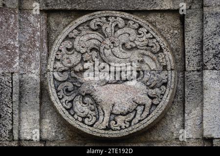 medallion in the penataran temple with animal reliefs. Stock Photo