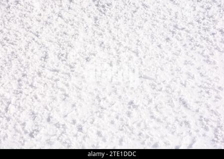closeup texture of a rough white snow. cold nature outdoor background Stock Photo