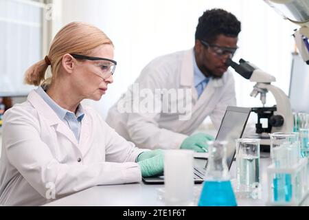 Two Scientists Working in Laboratory Stock Photo