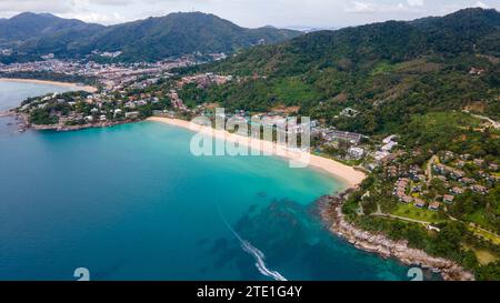 In an aerial view, Kata Noi beach stretches out along the Phuket coastline in Phuket Thailand. Thailand's tourism numbers are on track in 2023 to gove Stock Photo