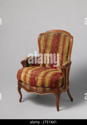 Bergère van Beukenhout, Anonymous, c. 1750 Bergère van Beukenhout, covered, with a loose high pillow and resting on the cornered S-shaped legs, which turn into the scalloped seating rules. Front legs decorated with triangular leaf motif. The semicircular sitting window is sculpted at the front. The armrests with cushions make out and are connected to the hold back window with its stretched S-shaped styles and scalloped upper sill. The armrest pits run back, come out of the sitting window and cross the layers in the layers. France wood (plant material). beech (wood). textile materials Bergère v Stock Photo