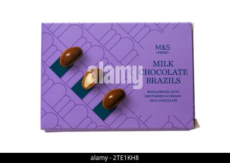 Box of Milk Chocolate coated Brazils brazil nuts isolated on white background Stock Photo