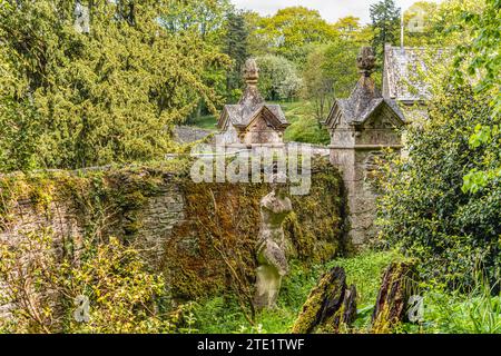 Ancient statues at the backyard of Buckland Abbey and Gardens, a 700-year-old house in Buckland Monachorum, near Yelverton, Devon, England Stock Photo