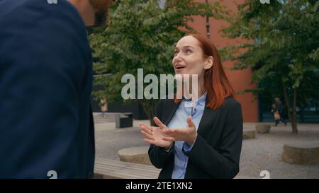 Work break in city office outside collaboration business partners happy laughing talking colleagues laugh funny discussion humorous smiling Stock Photo