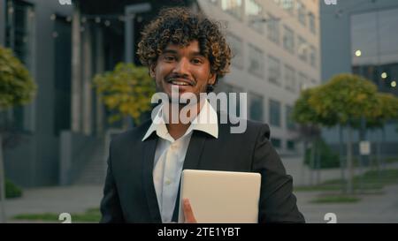 Indian guy student formal Arabian business man male employer entrepreneur manager worker intern businessman boss executive leader agent hold digital Stock Photo