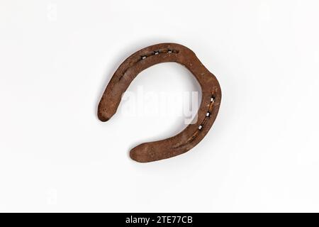 Rusty horseshoe isolated on a white background, Luck Stock Photo