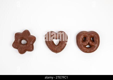 Gingerbread biscuits covered in chocolate and isolated on white background Stock Photo