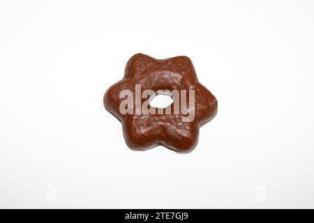 Gingerbread star biscuit covered in chocolate and isolated on white background Stock Photo