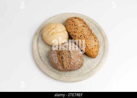 Breakfast Bread Rolls on a wooden plate Stock Photo